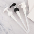 In-stock 32-tooth plastic black and white round-head pump, suitable for shampoo, lotion, shower gel, and body lotion. features a threaded pump head