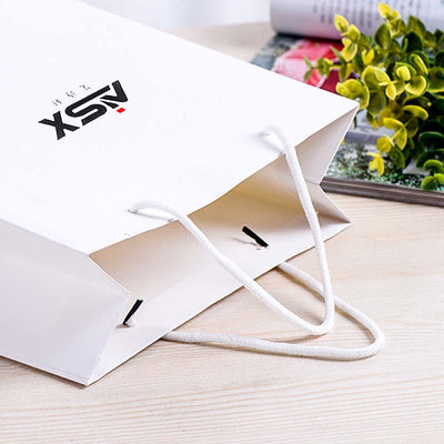 Wholesale paper bags from the manufacturer, specifically designed for aishixuandai brand perfume. available in various sizes, including large, medium, and small, in a versatile white color, perfect for gift packaging