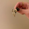 Golden small bow [about 1cm long]