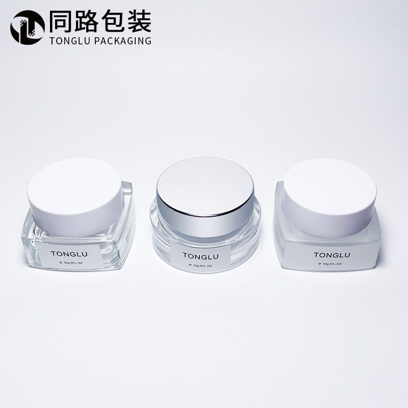 Ready-to-ship cosmetic cream jars, 50g frosted glass bottles with electroplated lids, available in square, round, and transparent wide-mouth styles