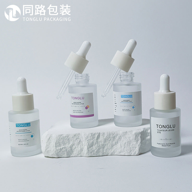Ready-to-ship cosmetic glass bottles and packaging materials: 30ml essential oil bottles, dropper essential oil dispensing bottles, and serum/essence glass bottles
