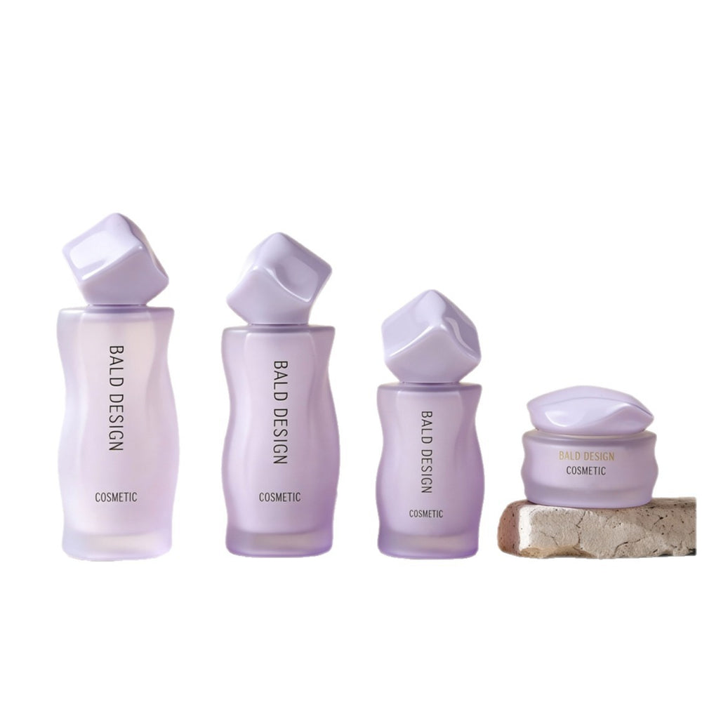 Customized cosmetic glass bottle set packaging, including 120ml glass bottles for toner, lotion, and serum, and 50g jars for creams and lotions