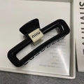 Glossy black - white label