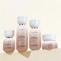 Ready-to-ship cosmetic glass bottle set packaging, including 120ml lotion/serum pump bottles and 50g cream/jar dispensing bottles