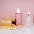 Customizable empty plastic bottles for shampoo, conditioner, and body wash - flat shoulder, pump dispenser, refillable
