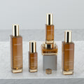 Ready-to-ship cosmetic glass bottle set packaging, including 120ml pump lotion/essential oil dispensing bottles and 50g skincare cream jars
