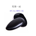 A pair of plastic ear tips