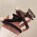 Niche stylesense of design z-shaped gripper 2025classy back of the head elegant hairdofashion pearl shark clip
