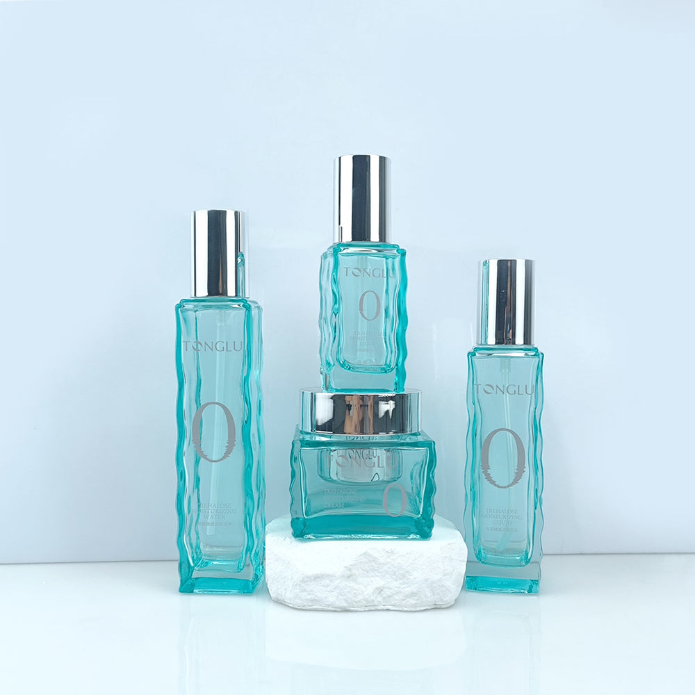 Ready-to-ship cosmetic glass bottle set packaging, including 120ml lotion/serum glass bottles and 50g cream jars, direct from the manufacturer